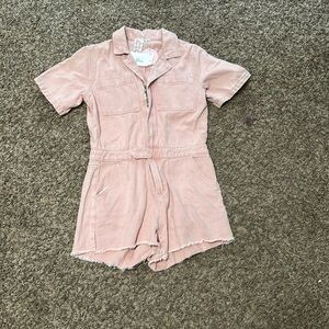 Light pink romper. Size medium. Never worn with tags!